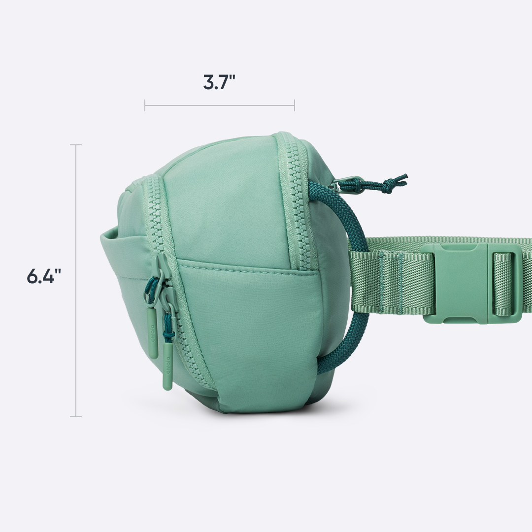 Owala All-Day Crossbody in Sea Glass, mint green nylon belt bag, side view dimensioned at 3.7 inches deep and 6.4 inches tall
